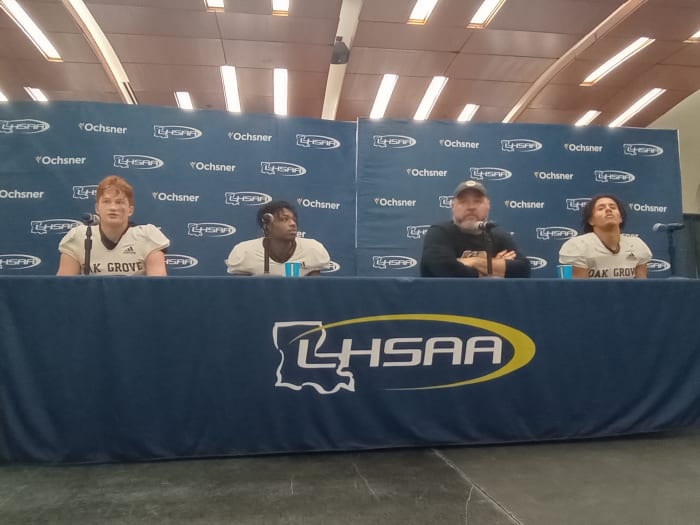 From left, Oak Grove QB Jackson Bradley, TB Decorian Freeman, coach Ryan Gregory and LB Kameron Franklin.